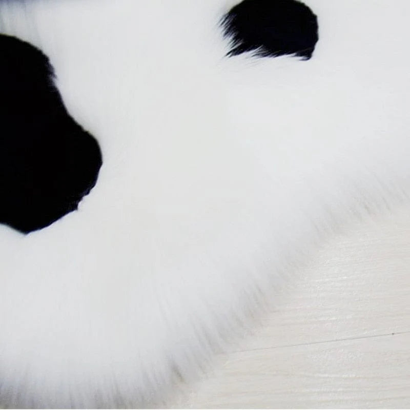 Soft rug in the shape of a cat paw